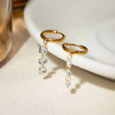 Gold Huggie Hoop Earrings with Dangling Zircon Stones – Elegant Minimalist Jewellery - DZOIR