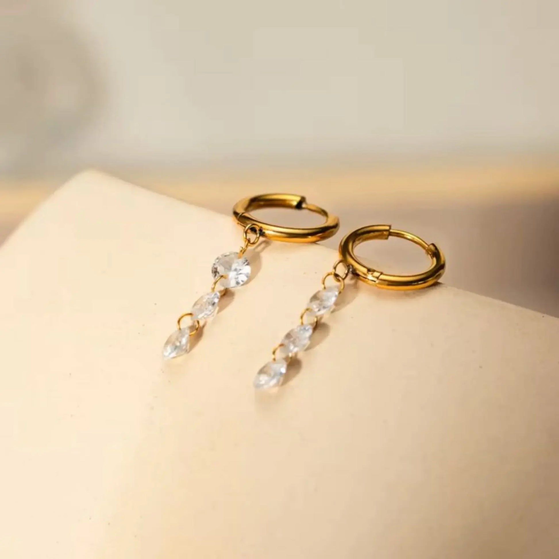 Gold Huggie Hoop Earrings with Dangling Zircon Stones – Elegant Minimalist Jewellery - BELARIC